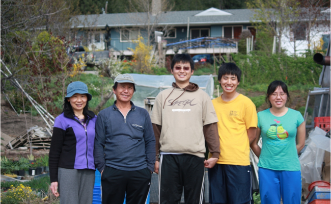 Chen's family in front of their house.
